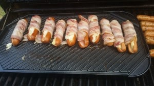 Cheese stuffed hot dogs wrapped in bacon.