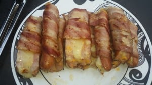 Cheese stuffed hot dogs wrapped in bacon.
